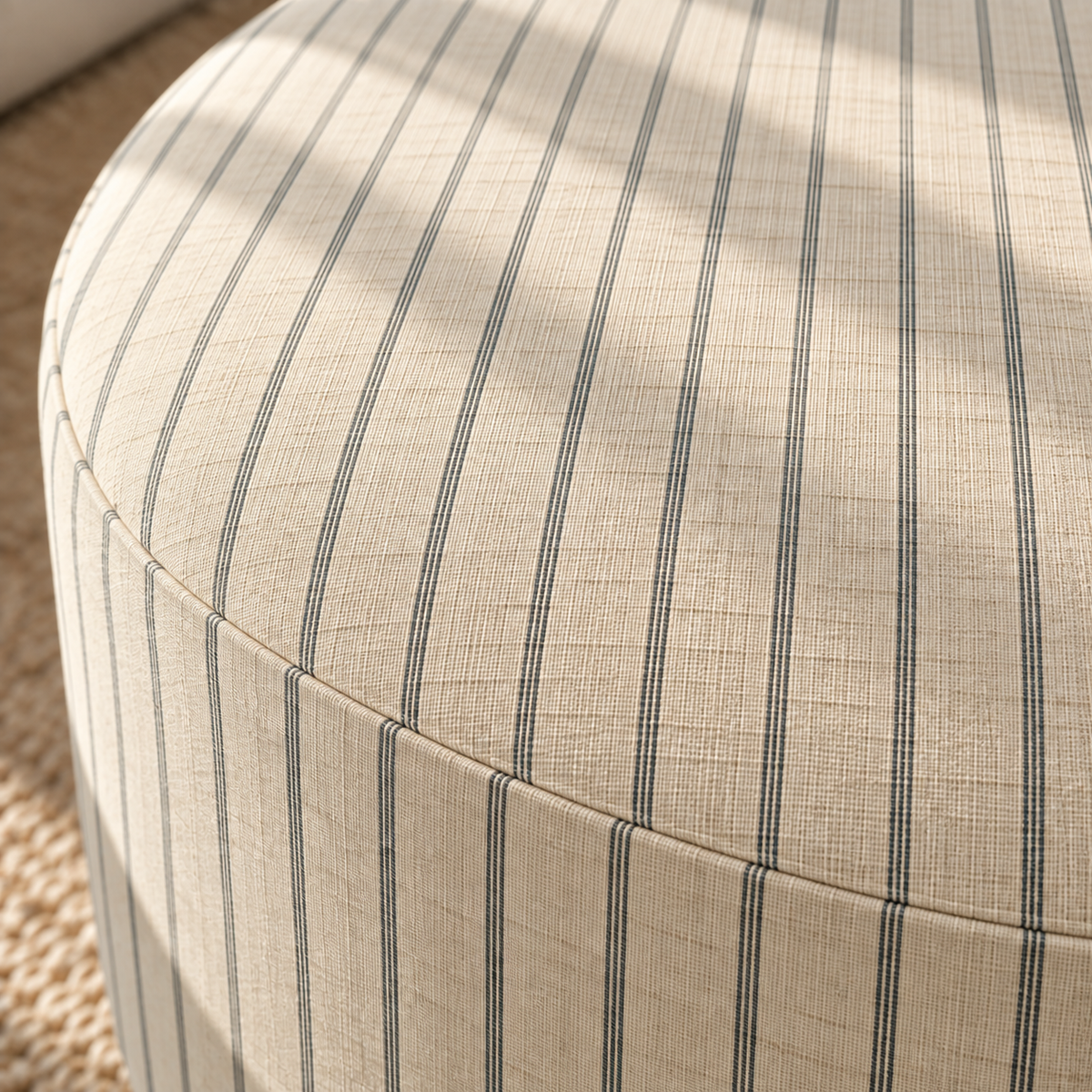 The Adelaide Ottoman in Jude Pinstripe