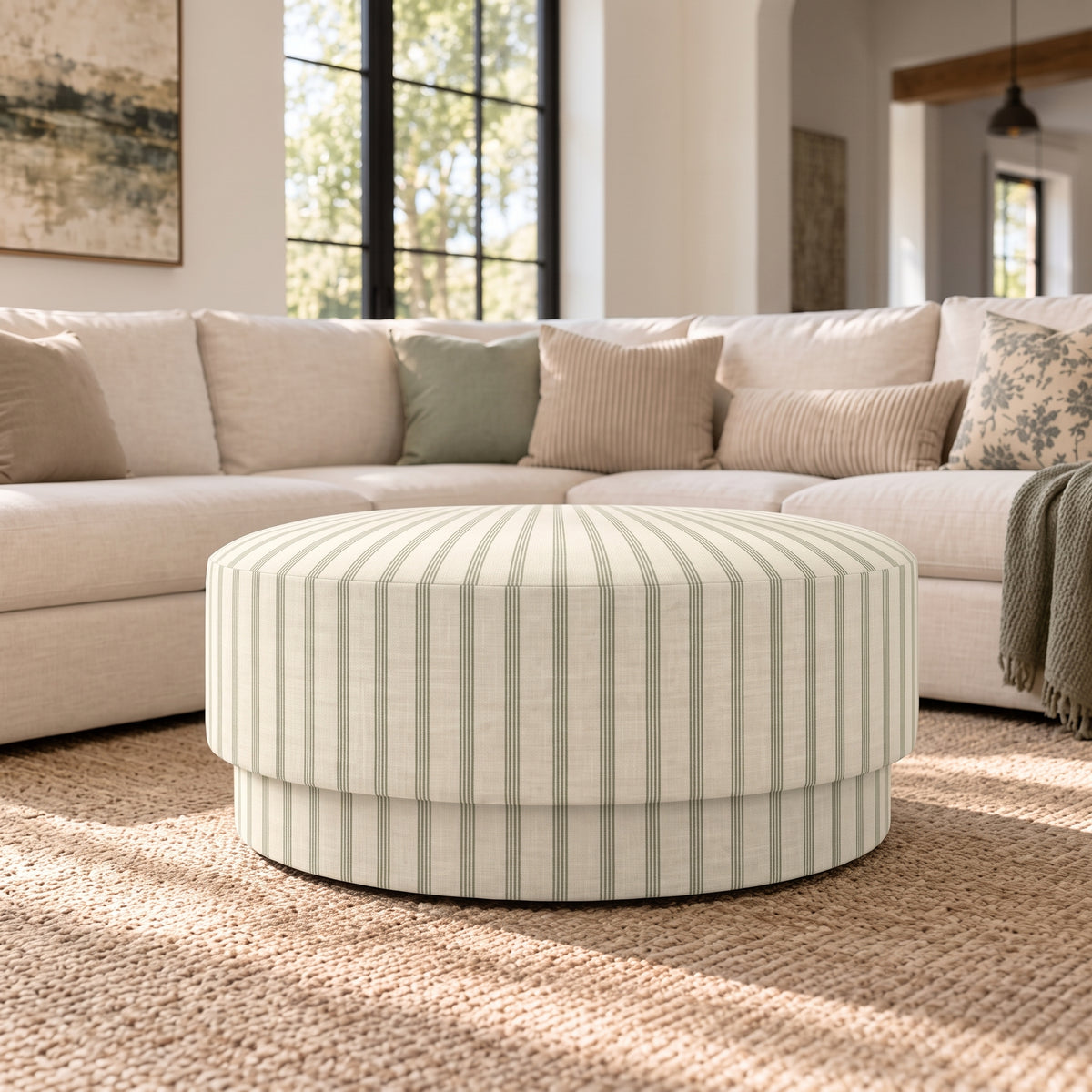 The Adelaide Ottoman in Orange County Olive Stripes